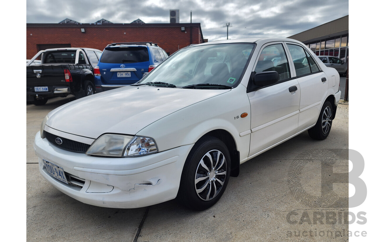 12/1999 Ford Laser LXi KJIII 4d Sedan White 1.6L