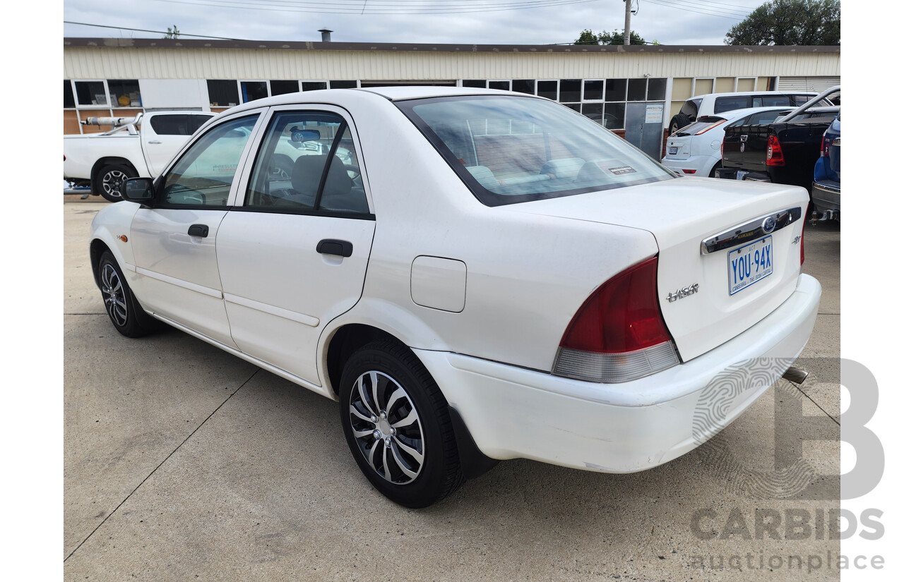 12/1999 Ford Laser LXi KJIII 4d Sedan White 1.6L