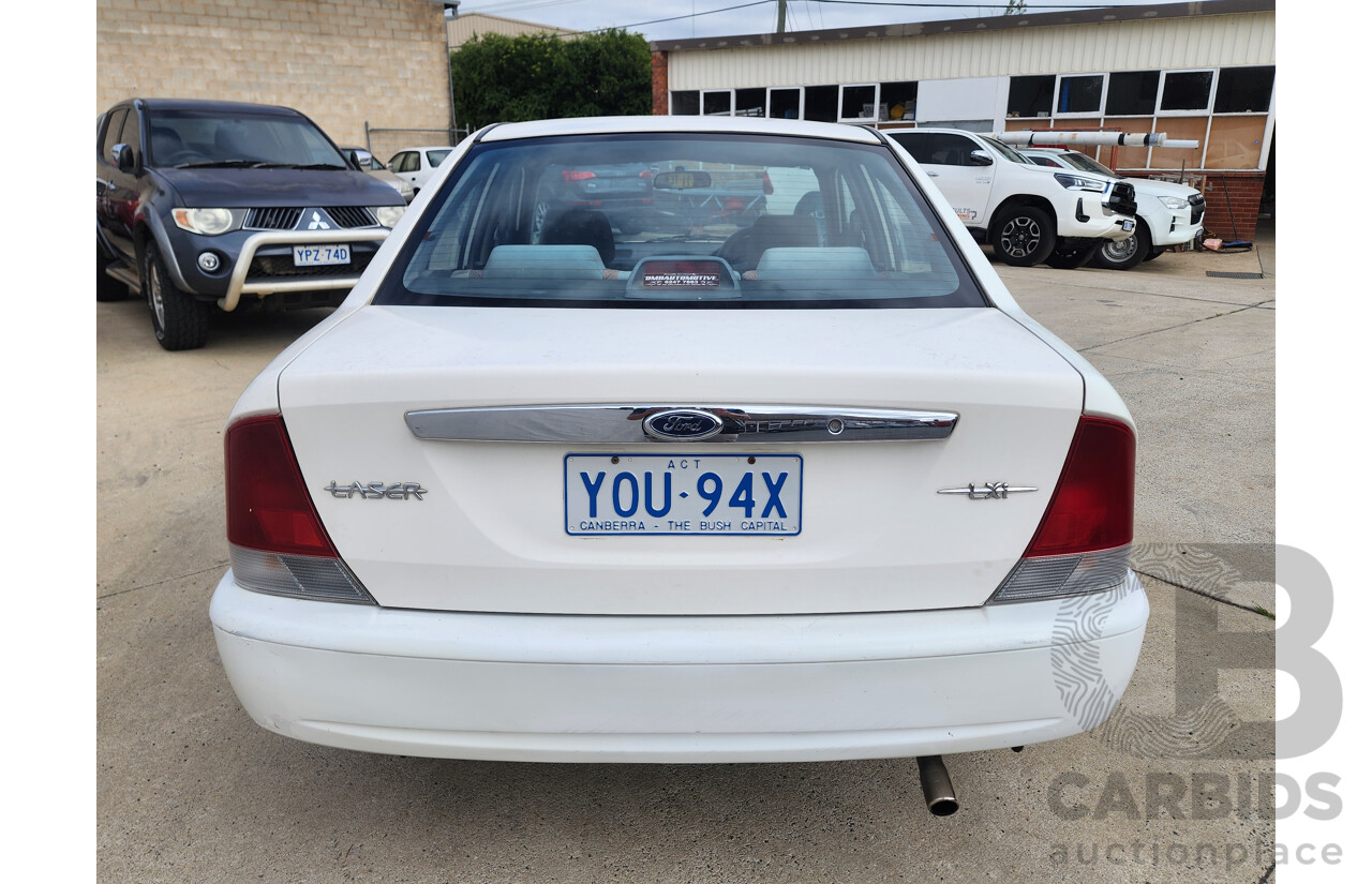 12/1999 Ford Laser LXi KJIII 4d Sedan White 1.6L