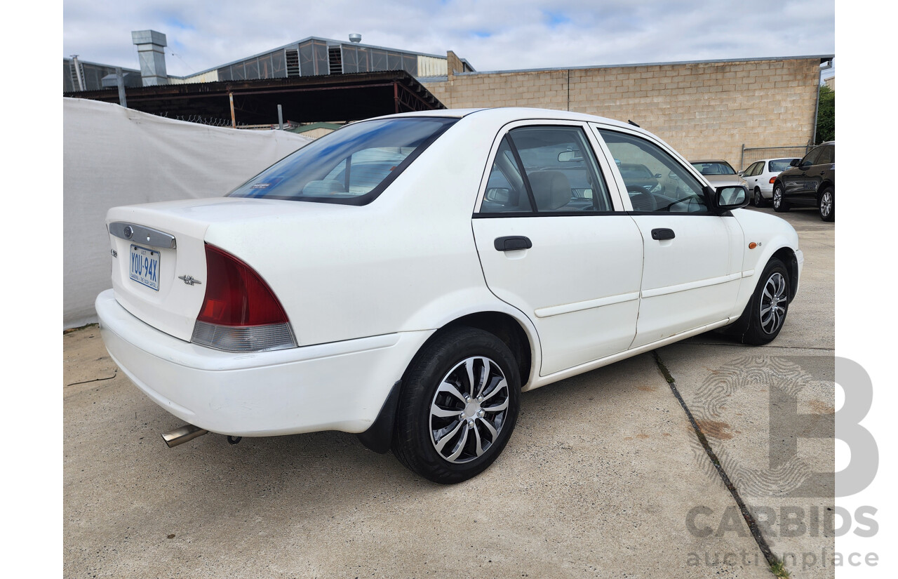 12/1999 Ford Laser LXi KJIII 4d Sedan White 1.6L