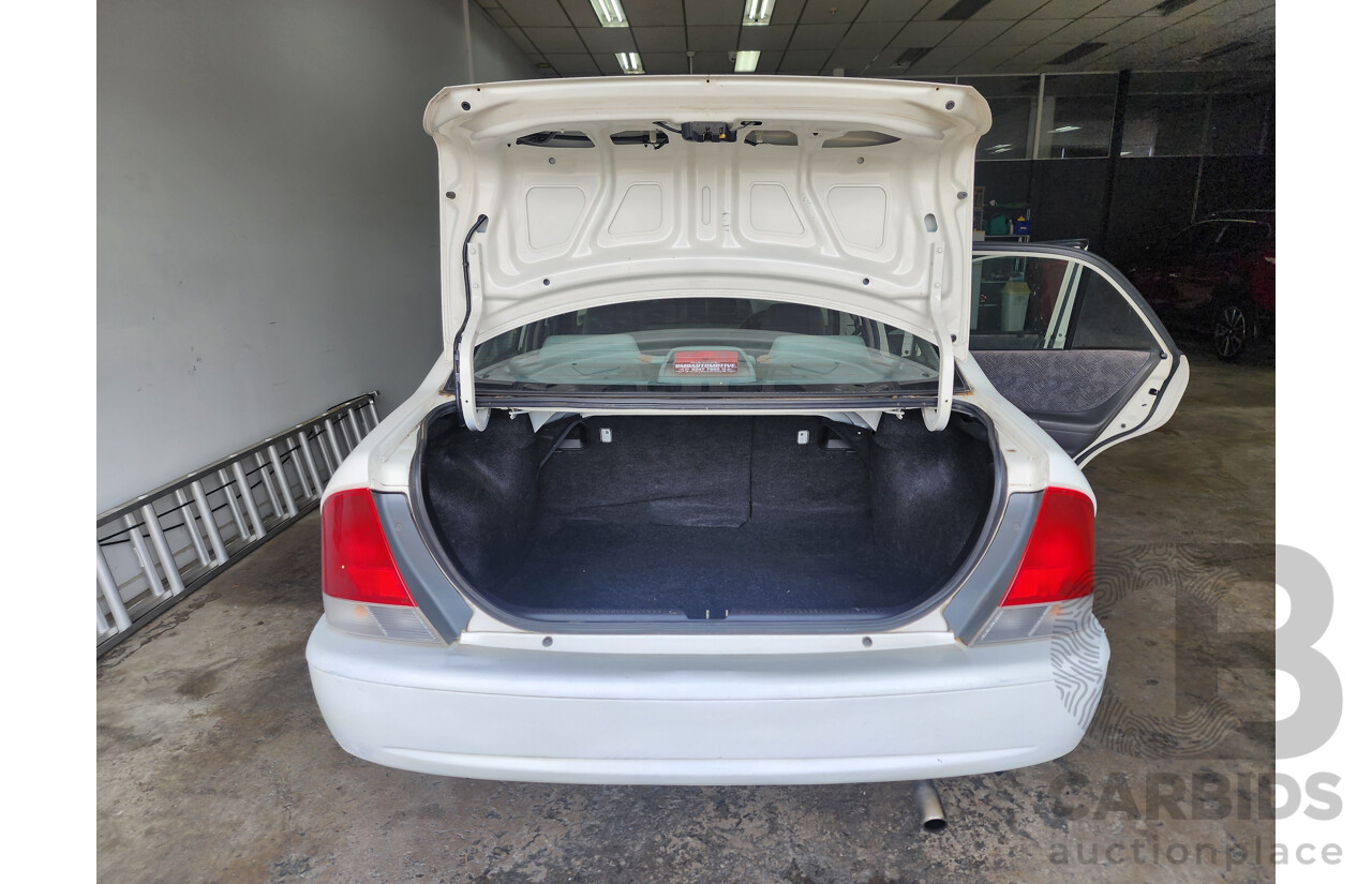 12/1999 Ford Laser LXi KJIII 4d Sedan White 1.6L