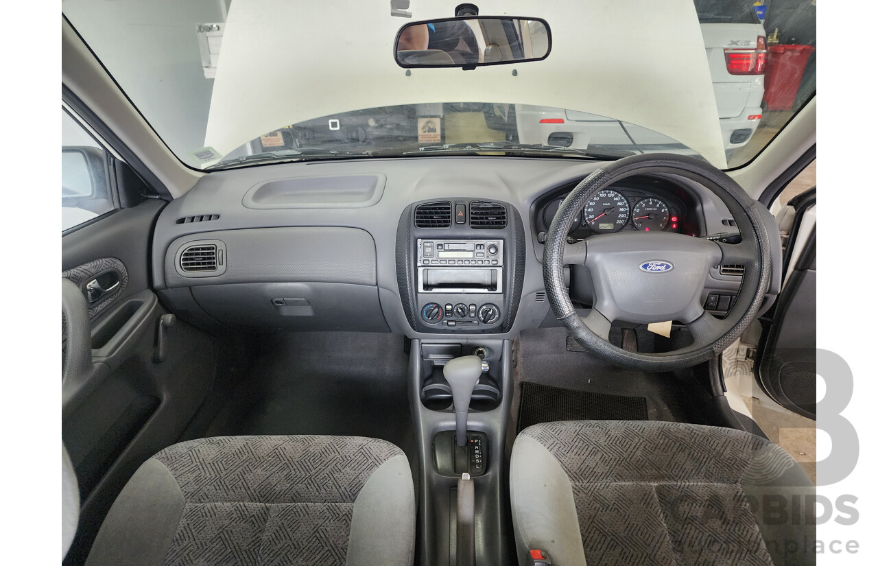 12/1999 Ford Laser LXi KJIII 4d Sedan White 1.6L