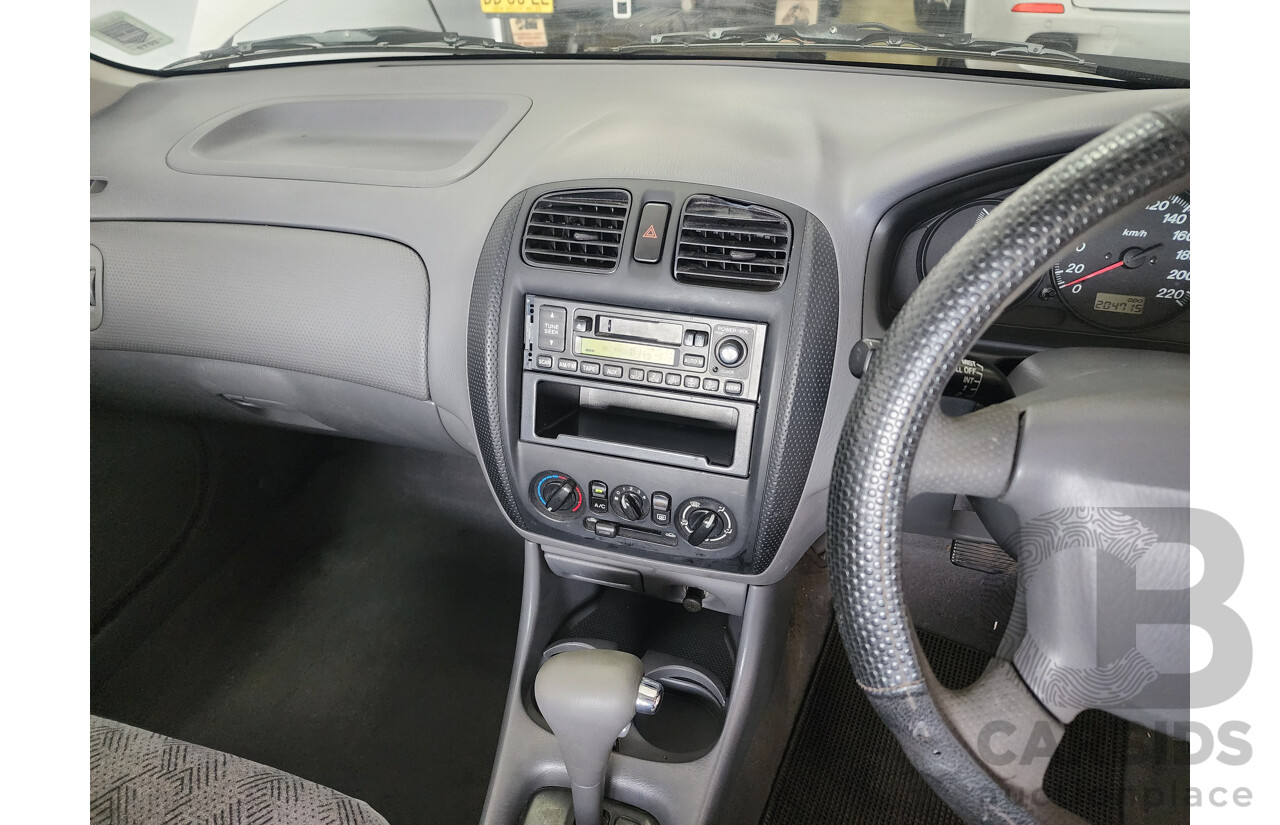 12/1999 Ford Laser LXi KJIII 4d Sedan White 1.6L