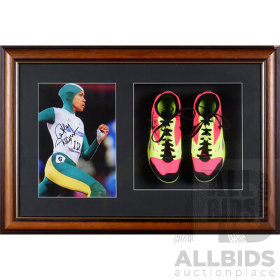 L42 - Cathy Freeman framed shoes signed by Cathy with Certificate of Authenticity