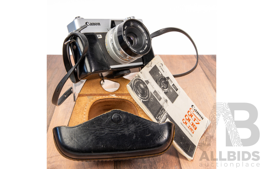 Vintage Canon QL 35mm Film Camera with Leather Case and Instruction Manual