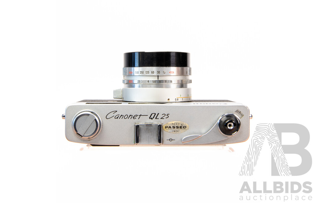 Vintage Canon QL 35mm Film Camera with Leather Case and Instruction Manual