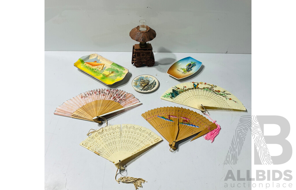Collection of Lovely Ceramic Decorative Items Including Small Carriage Form Oil Lamp, Several Painted Plates and Platters and Small Fans