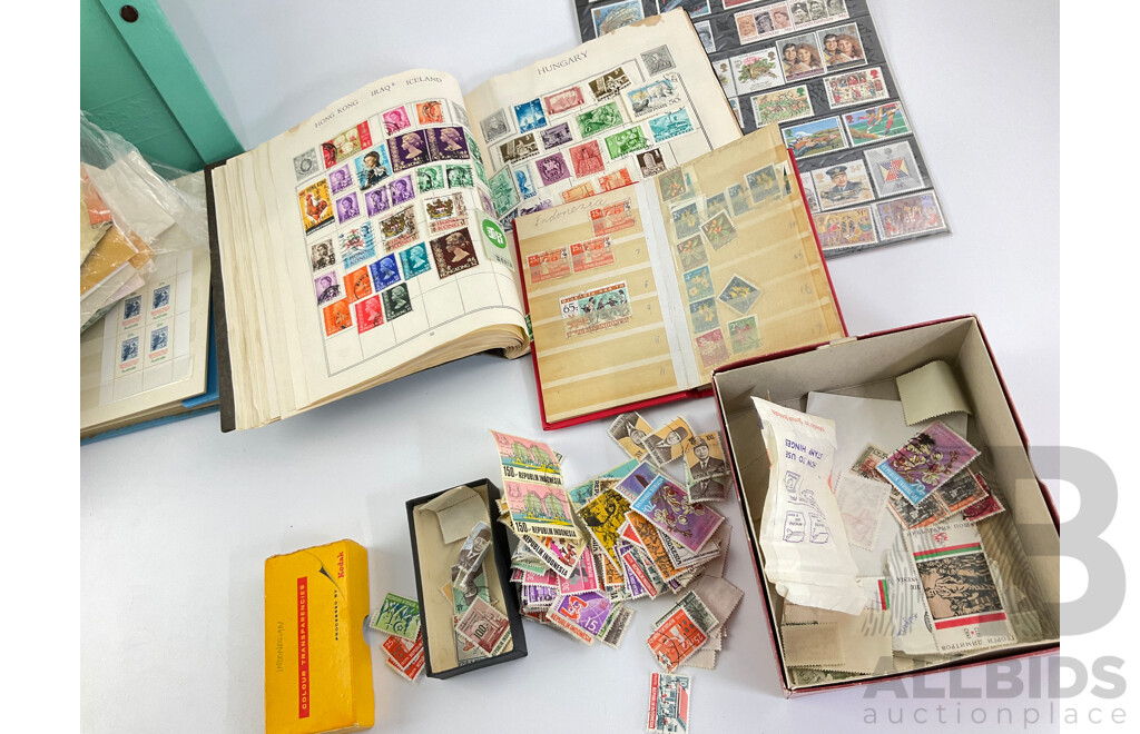 Collection of International Philately Including British Mint 1986 Mint Stamp Collectors Pack, All Nations Stamp Album, The Globe Stamp Album, USA, Indonesia, Netherland, Australia, Mongolia, UK and More