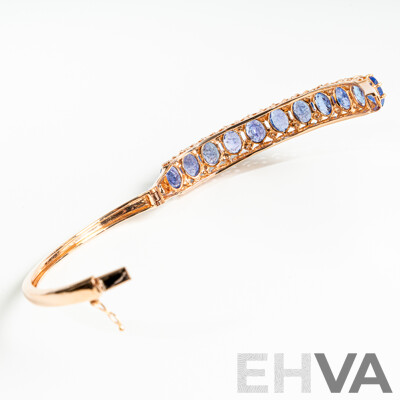NEW - 14ct Rose Gold Tanzanite & Diamond Oval Hinged Bangle, T15.17ct/TDW0.19ct, 60mm, 22.67 Grams