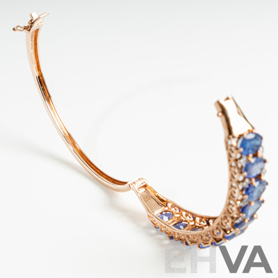 NEW - 14ct Rose Gold Tanzanite & Diamond Oval Hinged Bangle, T15.17ct/TDW0.19ct, 60mm, 22.67 Grams