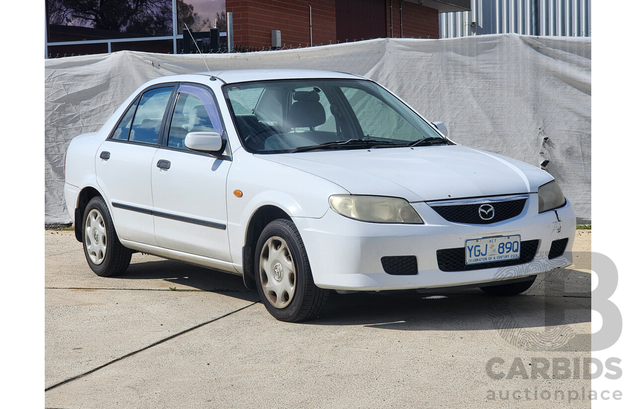 3/2002 Mazda 323 Protege Shades  4d Sedan White 1.6L