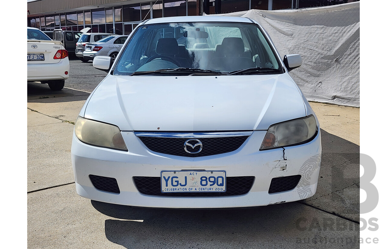 3/2002 Mazda 323 Protege Shades  4d Sedan White 1.6L