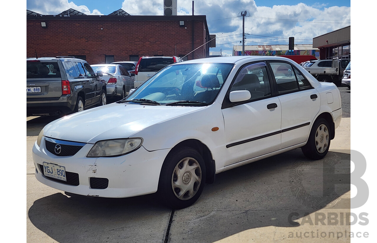 3/2002 Mazda 323 Protege Shades  4d Sedan White 1.6L