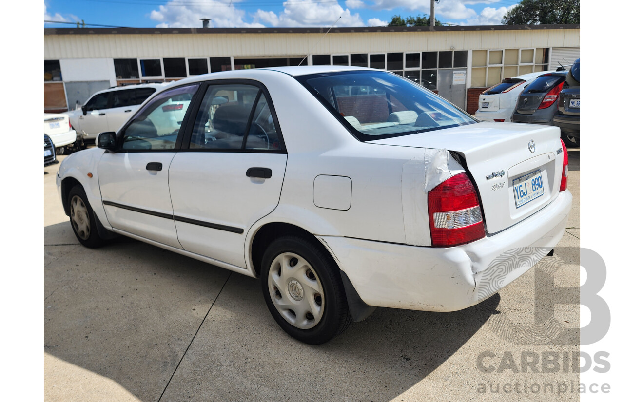 3/2002 Mazda 323 Protege Shades  4d Sedan White 1.6L