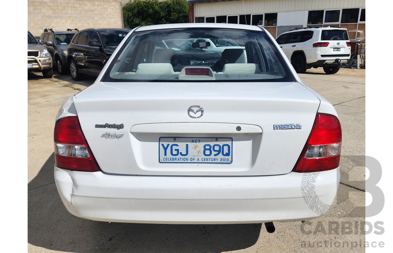 3/2002 Mazda 323 Protege Shades  4d Sedan White 1.6L