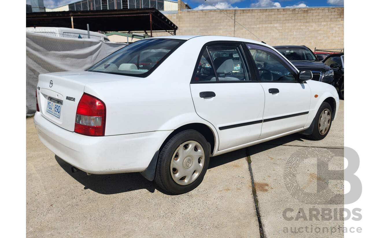 3/2002 Mazda 323 Protege Shades  4d Sedan White 1.6L