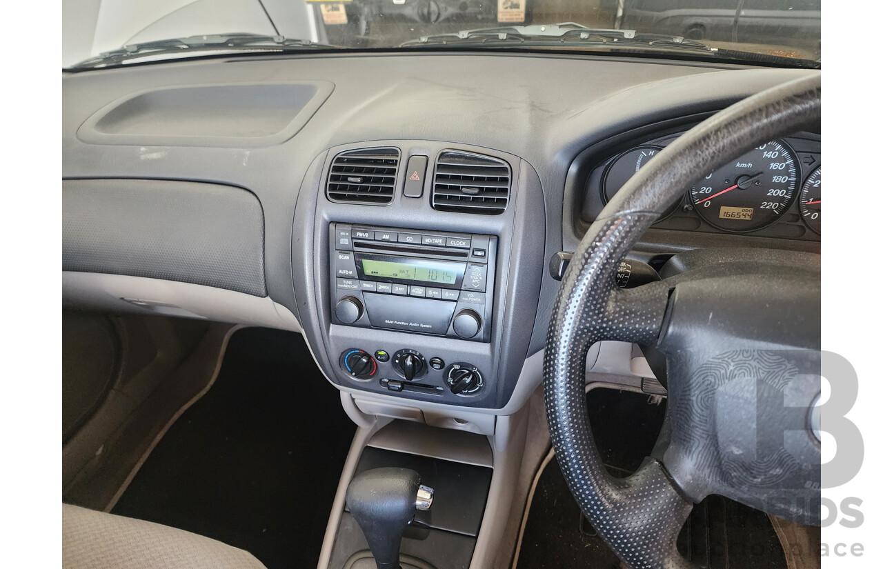 3/2002 Mazda 323 Protege Shades  4d Sedan White 1.6L