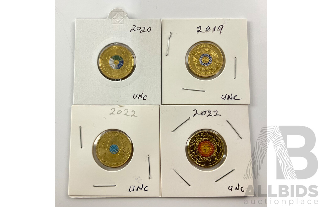 Four Australian Commemorative Two Dollar Coins Including 2019 Police Remembrance, 2022 Seventy Five Years Peace Keeping, 2022 Honey Bee, 2020 Seventy Five Years End WW2