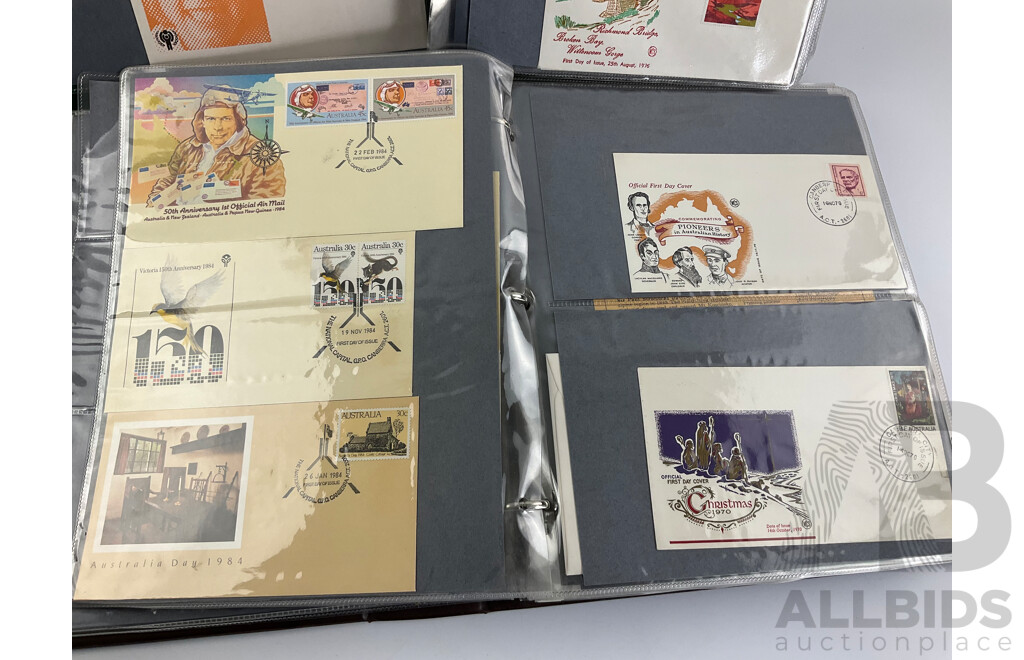 Two Albums of Australian 1970-80's First Day Covers and Stamp Packs Including 1984 Christmas, AUSIPEX, Conservation, Selected Issues, 1982 QE2 Birthday, Antarctic Territory and More