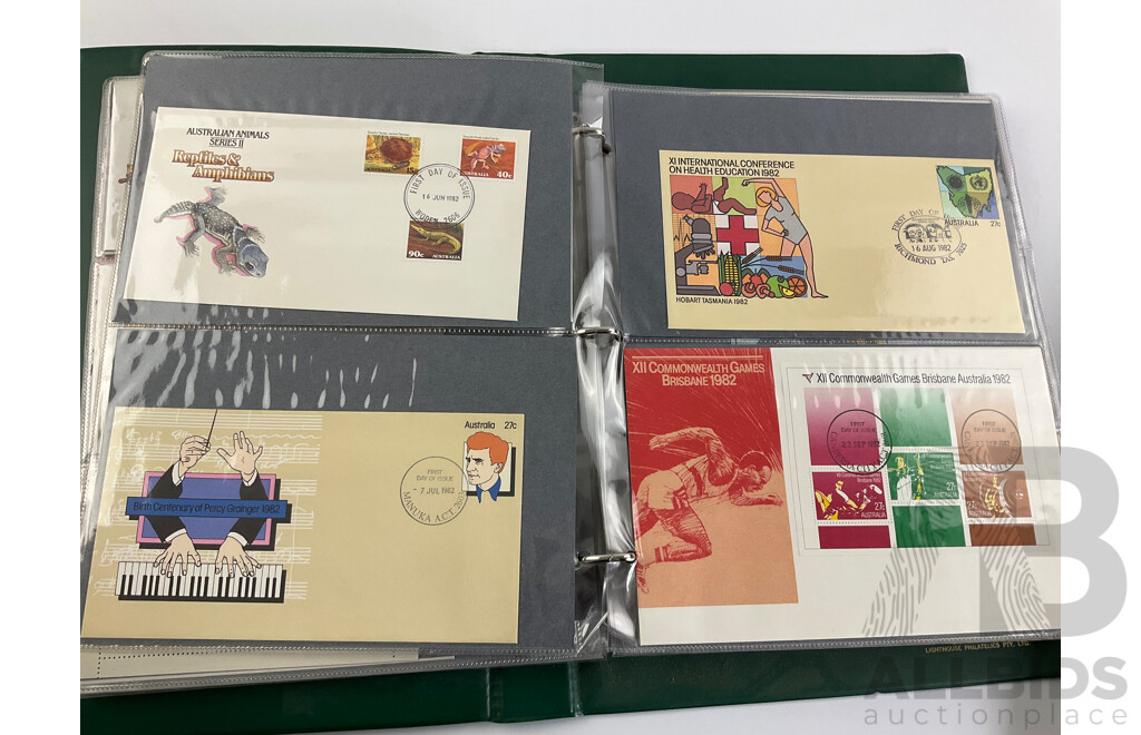 Two Albums of Australian 1970-80's First Day Covers and Stamp Packs Including 1984 Christmas, AUSIPEX, Conservation, Selected Issues, 1982 QE2 Birthday, Antarctic Territory and More