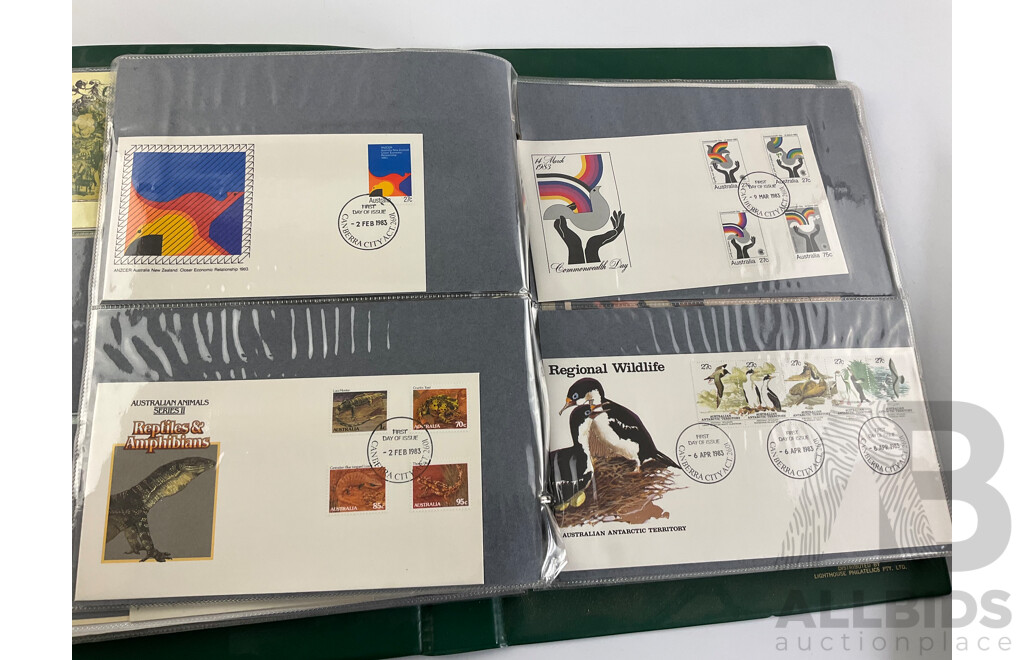 Two Albums of Australian 1970-80's First Day Covers and Stamp Packs Including 1984 Christmas, AUSIPEX, Conservation, Selected Issues, 1982 QE2 Birthday, Antarctic Territory and More