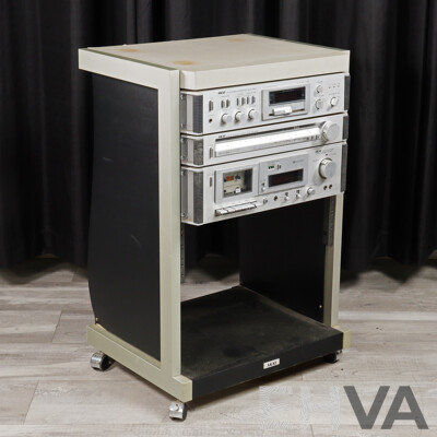 Akai Three Piece Rack Mounted Stereo System Comprising Dc Integrated Amplifier AM UO3, Stereo Tuner at KO2 & Stereo Casette Deck CS MO2, All in Akai Case