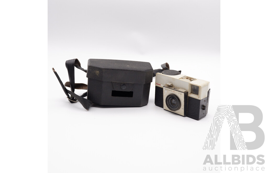 Vintage Kodak Instamatic 25 Camera, Brownie Camera, Two Slide Viewers, Leather Camera Case, Sports Binoculars, and a Flash Unit