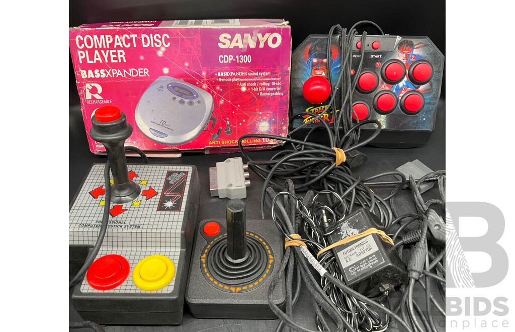 Assorted RETRO Video Games Joysticks and Sanyo CD Player - Lot of 4