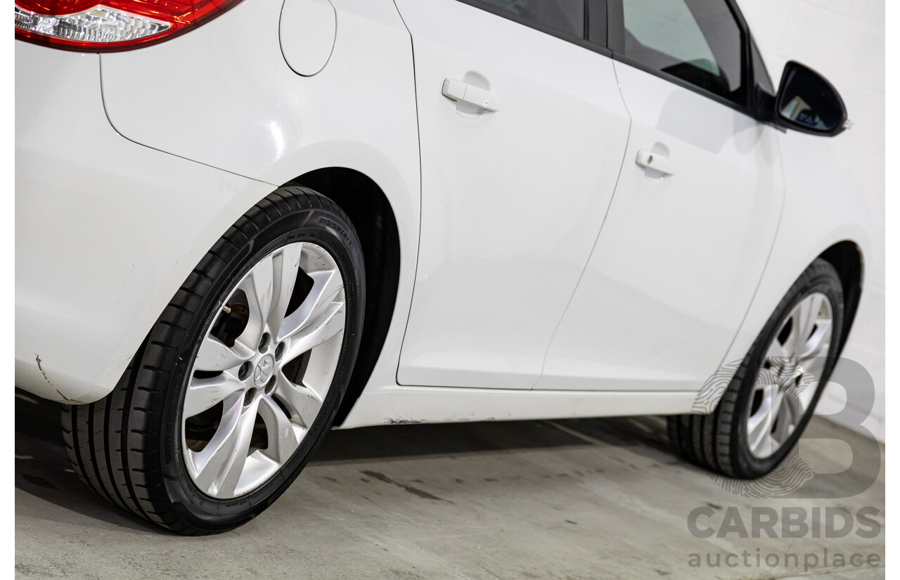 9/2015 Holden Cruze Equipe JH MY15 5d Hatchback White 1.8L