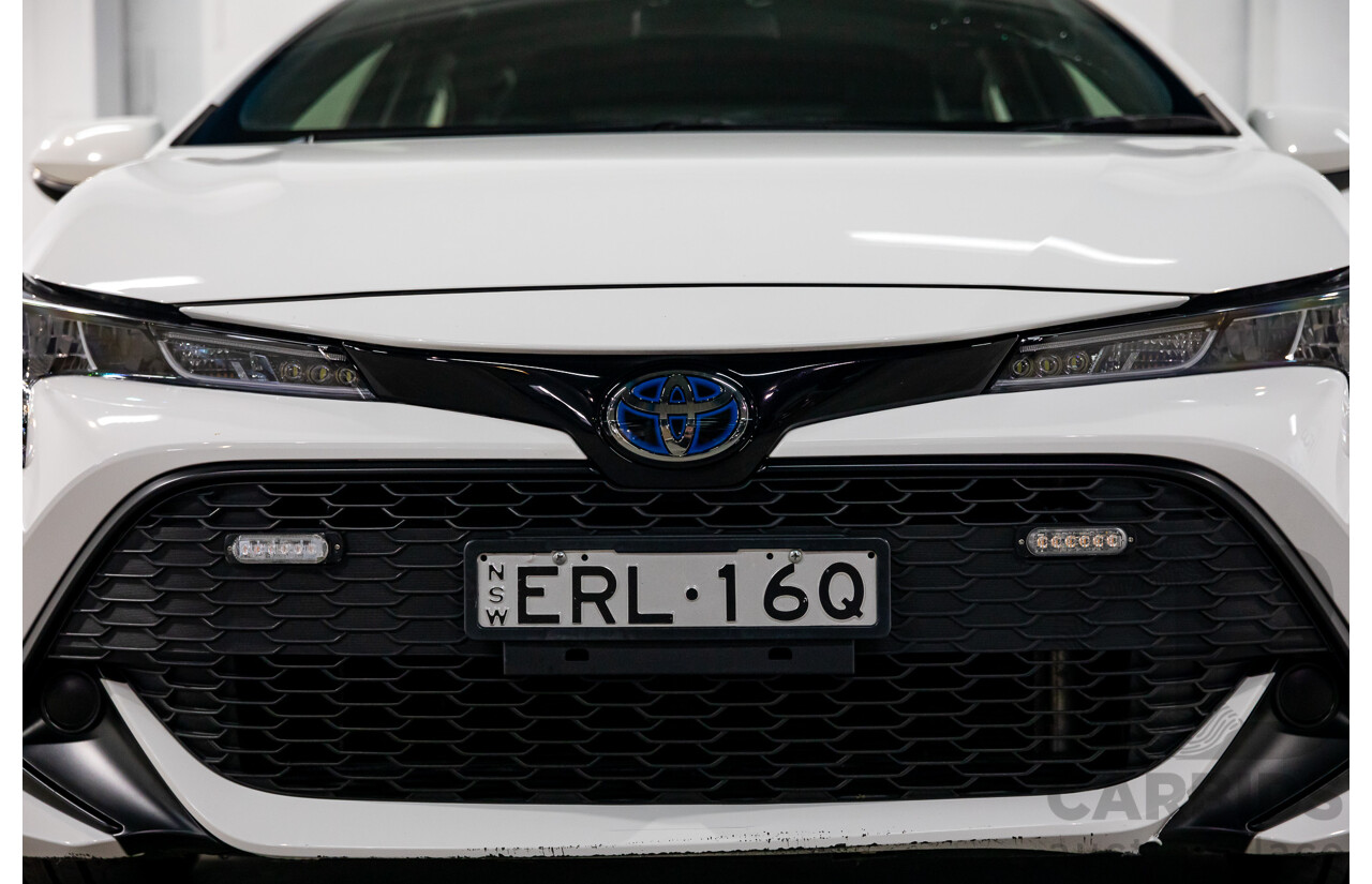 09/2020 Toyota Corolla Ascent Sport Hybrid (FWD) ZWE211R 5d Hatchback Glacier White 1.8L - Hybrid