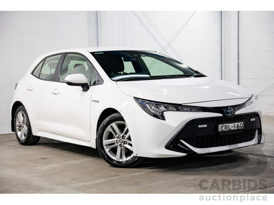 09/2020 Toyota Corolla Ascent Sport Hybrid (FWD) ZWE211R 5d Hatchback Glacier White 1.8L - Hybrid