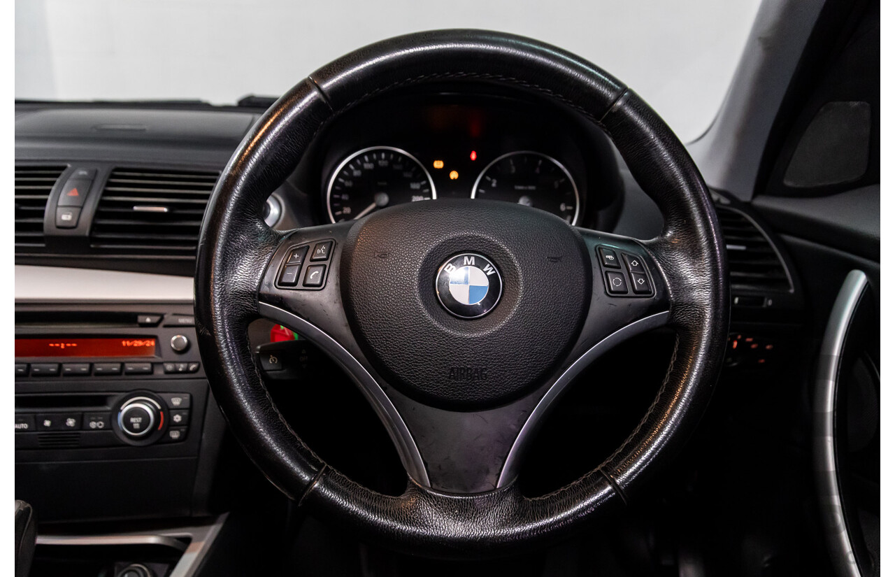 2/2009 BMW 120i E87 MY09 5d Hatchback Jet Black 2.0L