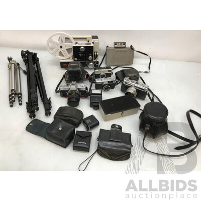 Assorted Vintage Photography and Media Equipment Including Cameras, Tripods, and Projector