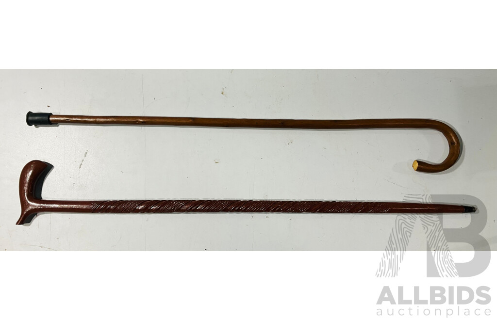 Two Wooden Walking Sticks Including One Example with Carving