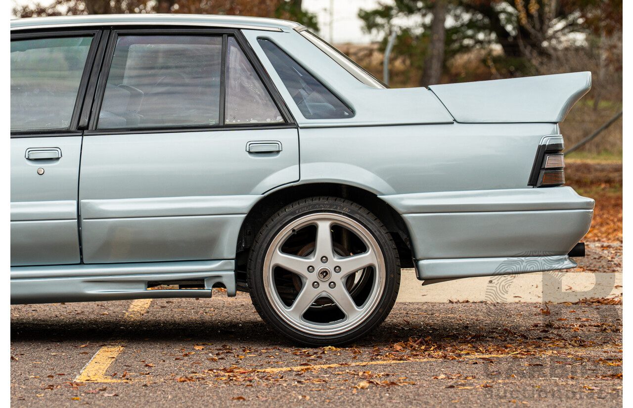 10/1986 Holden VL Commodore Executive - Walkinshaw Group A Replica 4d Sedan Panorama Silver 3.0L