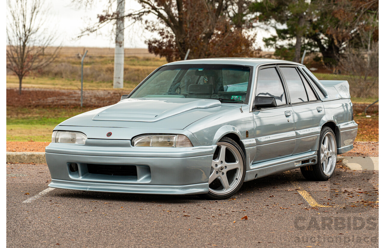 10/1986 Holden VL Commodore Executive - Walkinshaw Group A Replica 4d Sedan Panorama Silver 3.0L
