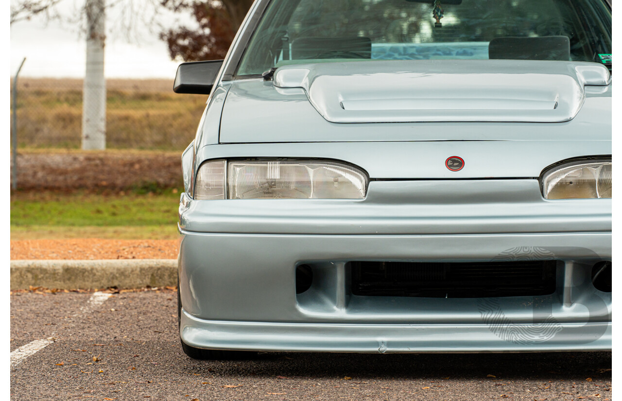 10/1986 Holden VL Commodore Executive - Walkinshaw Group A Replica 4d Sedan Panorama Silver 3.0L