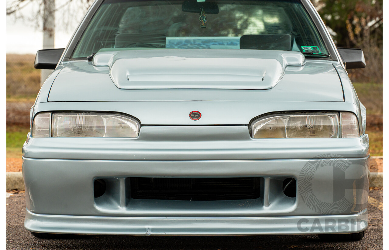 10/1986 Holden VL Commodore Executive - Walkinshaw Group A Replica 4d Sedan Panorama Silver 3.0L