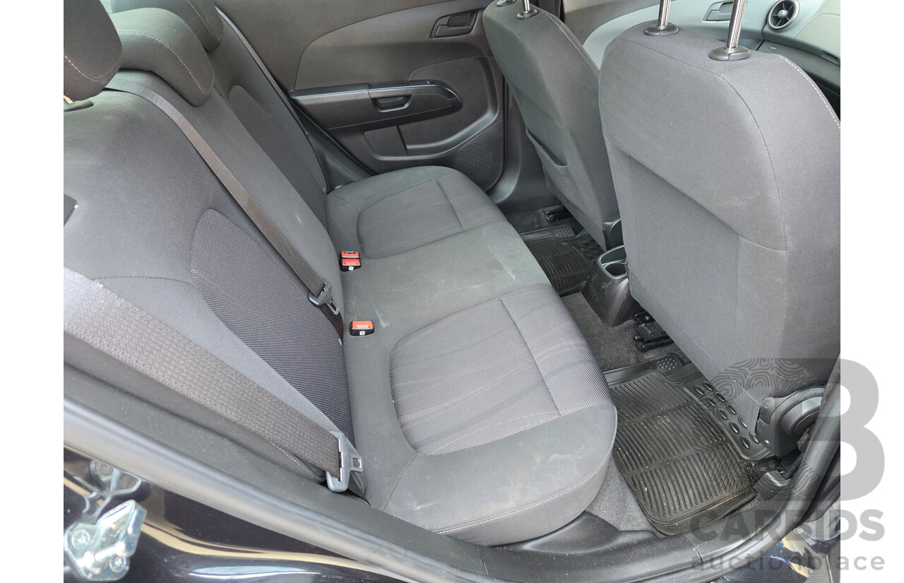 6/2013 Holden Barina CD TM MY13 4d Sedan Black 1.6L