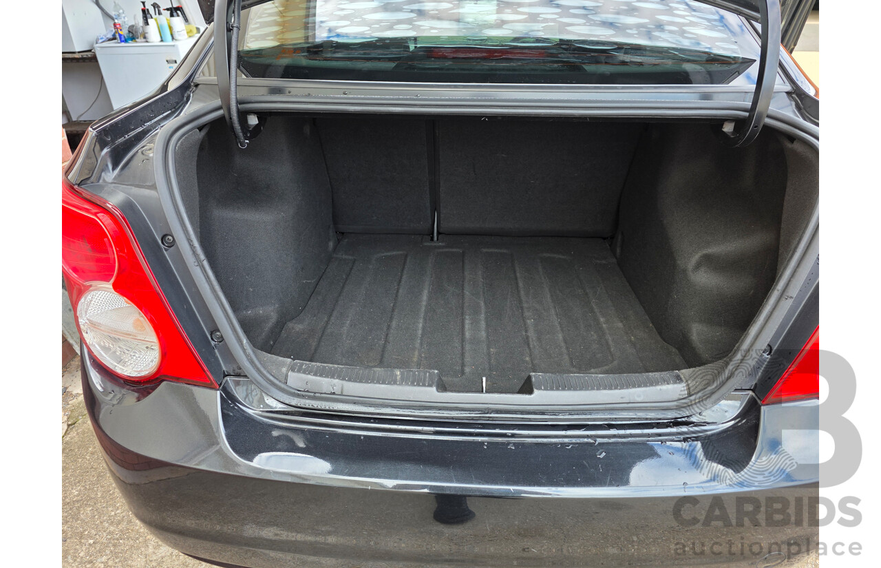 6/2013 Holden Barina CD TM MY13 4d Sedan Black 1.6L