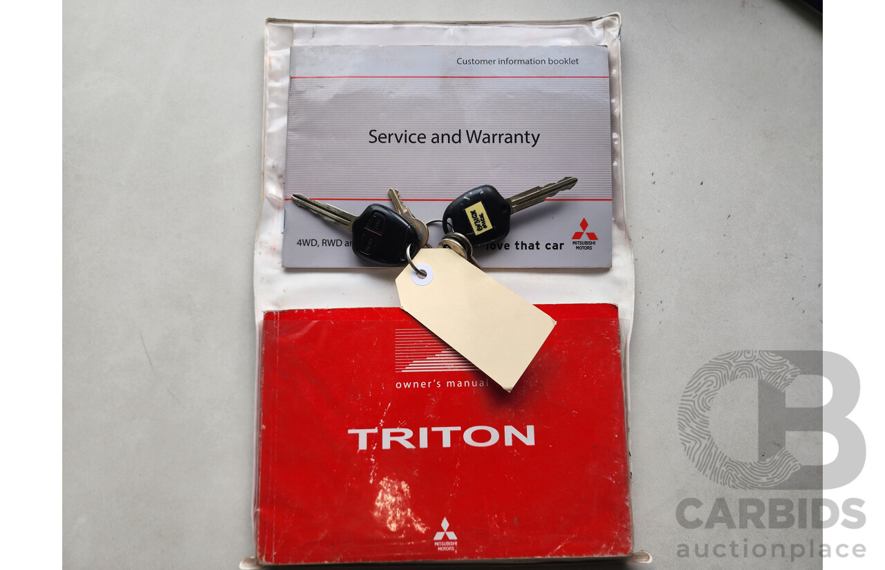 2/2013 Mitsubishi Triton Glx-R (4x4) MN MY13 Double Cab Utility White 2.5L