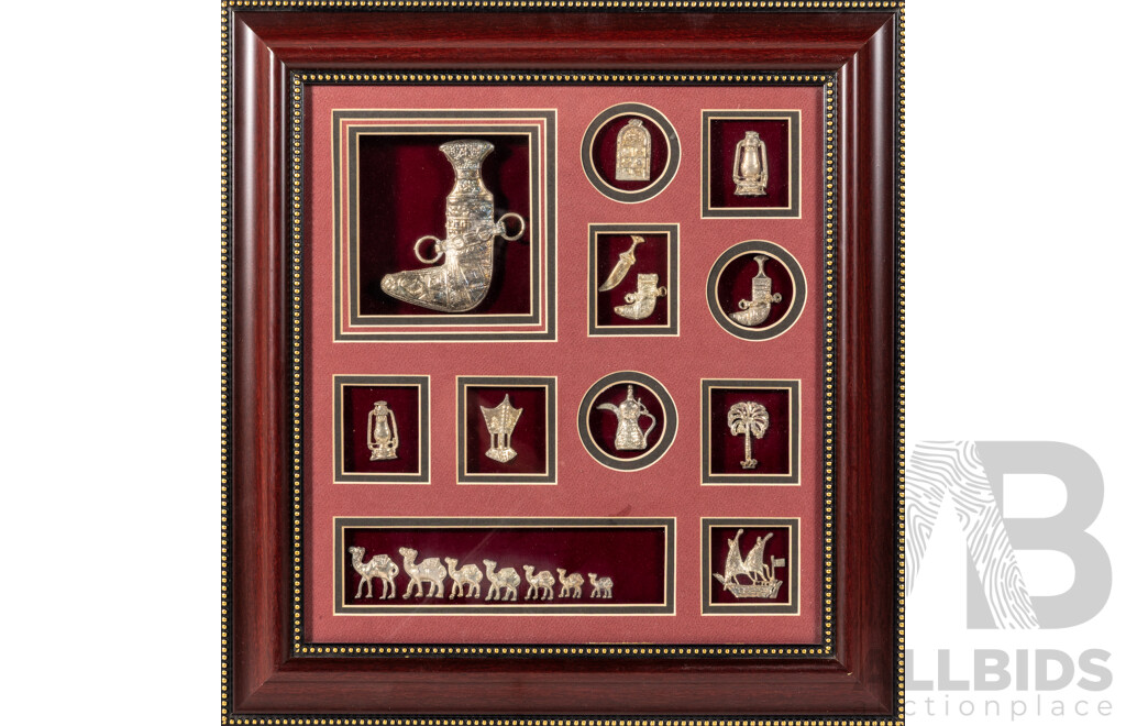Artist Unknown (20th Century), Eleven Arab Souvenirs in Individual Windows, Cast Metal in Glass Covered Wooden Frame. 45 x 43 cm (frame)