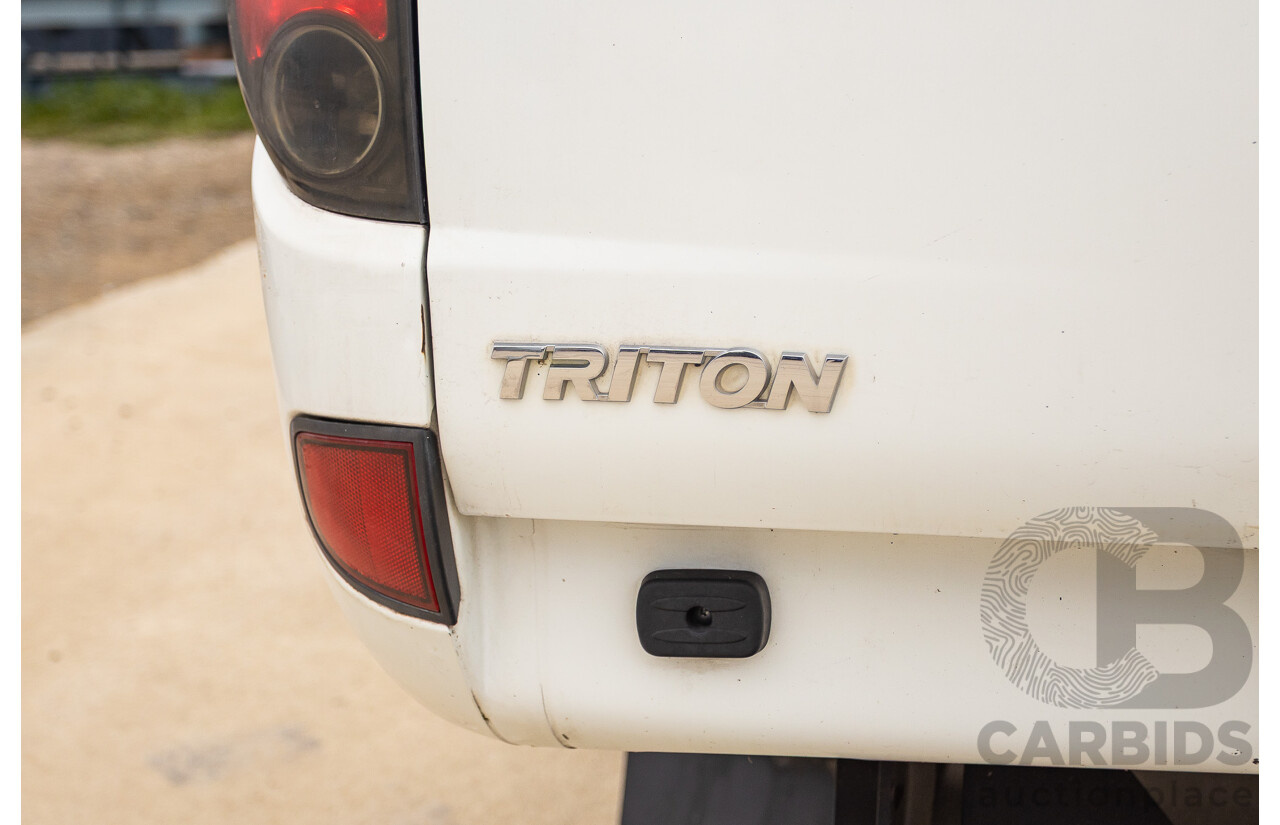 9/2014 Mitsubishi Triton GLX (4x4) MN MY14 UPDATE Double Cab Utility White Turbo Diesel 2.5L