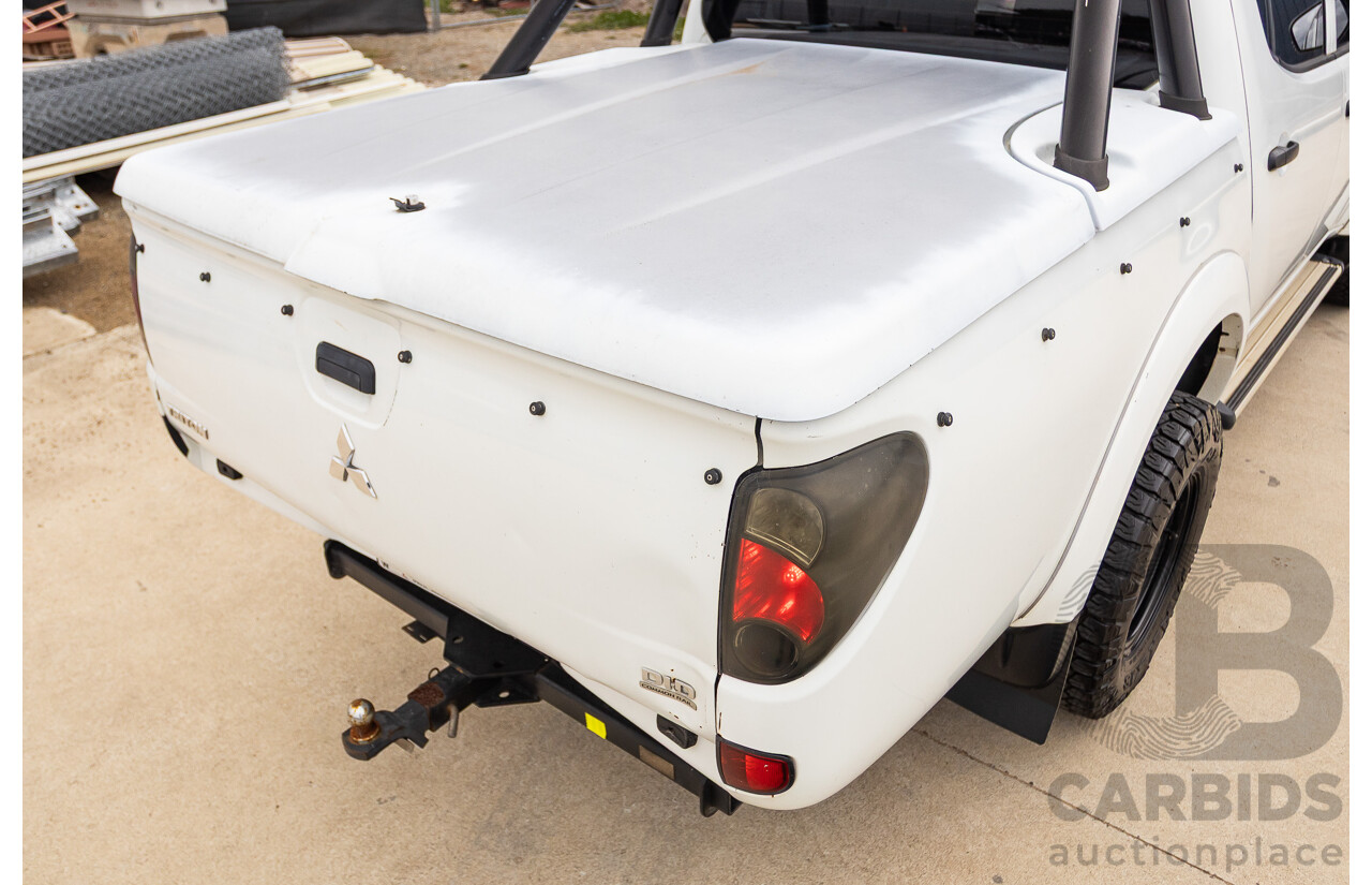 9/2014 Mitsubishi Triton GLX (4x4) MN MY14 UPDATE Double Cab Utility White Turbo Diesel 2.5L