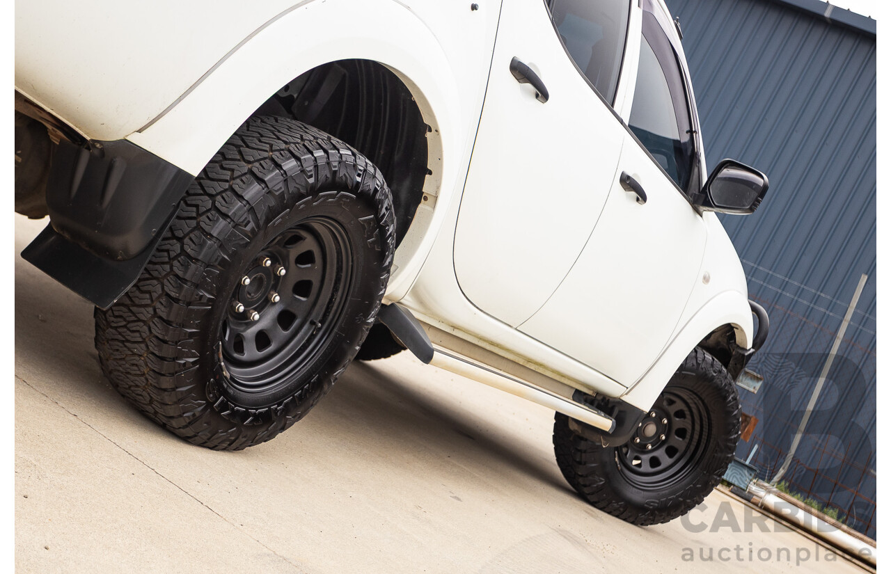9/2014 Mitsubishi Triton GLX (4x4) MN MY14 UPDATE Double Cab Utility White Turbo Diesel 2.5L