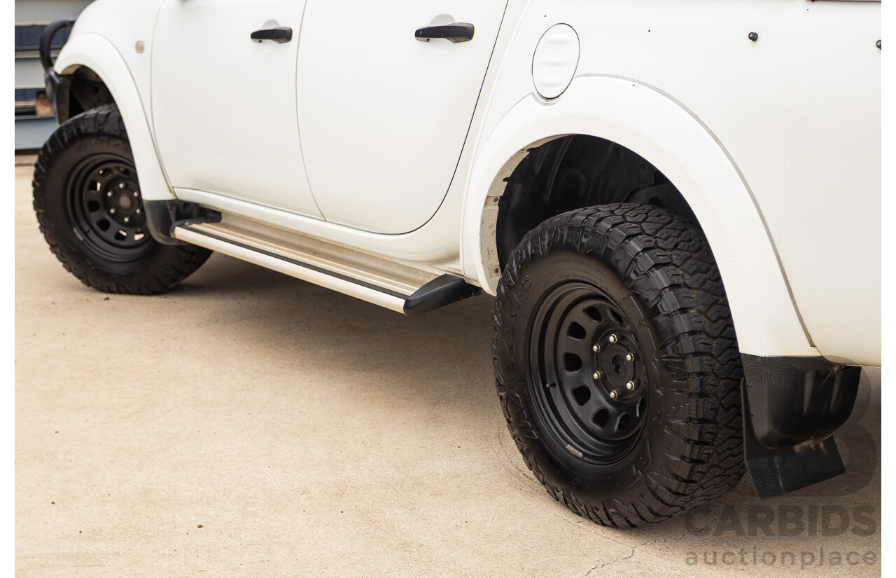 9/2014 Mitsubishi Triton GLX (4x4) MN MY14 UPDATE Double Cab Utility White Turbo Diesel 2.5L