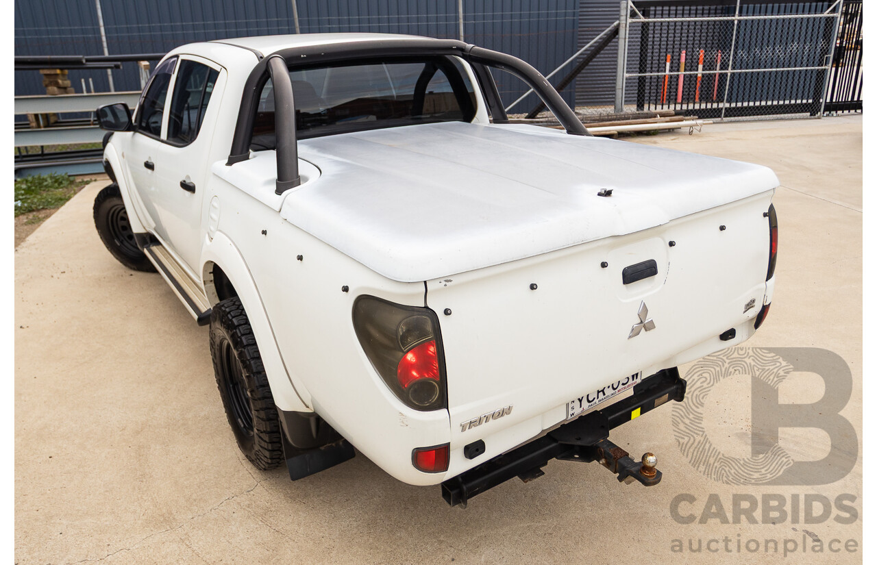 9/2014 Mitsubishi Triton GLX (4x4) MN MY14 UPDATE Double Cab Utility White Turbo Diesel 2.5L
