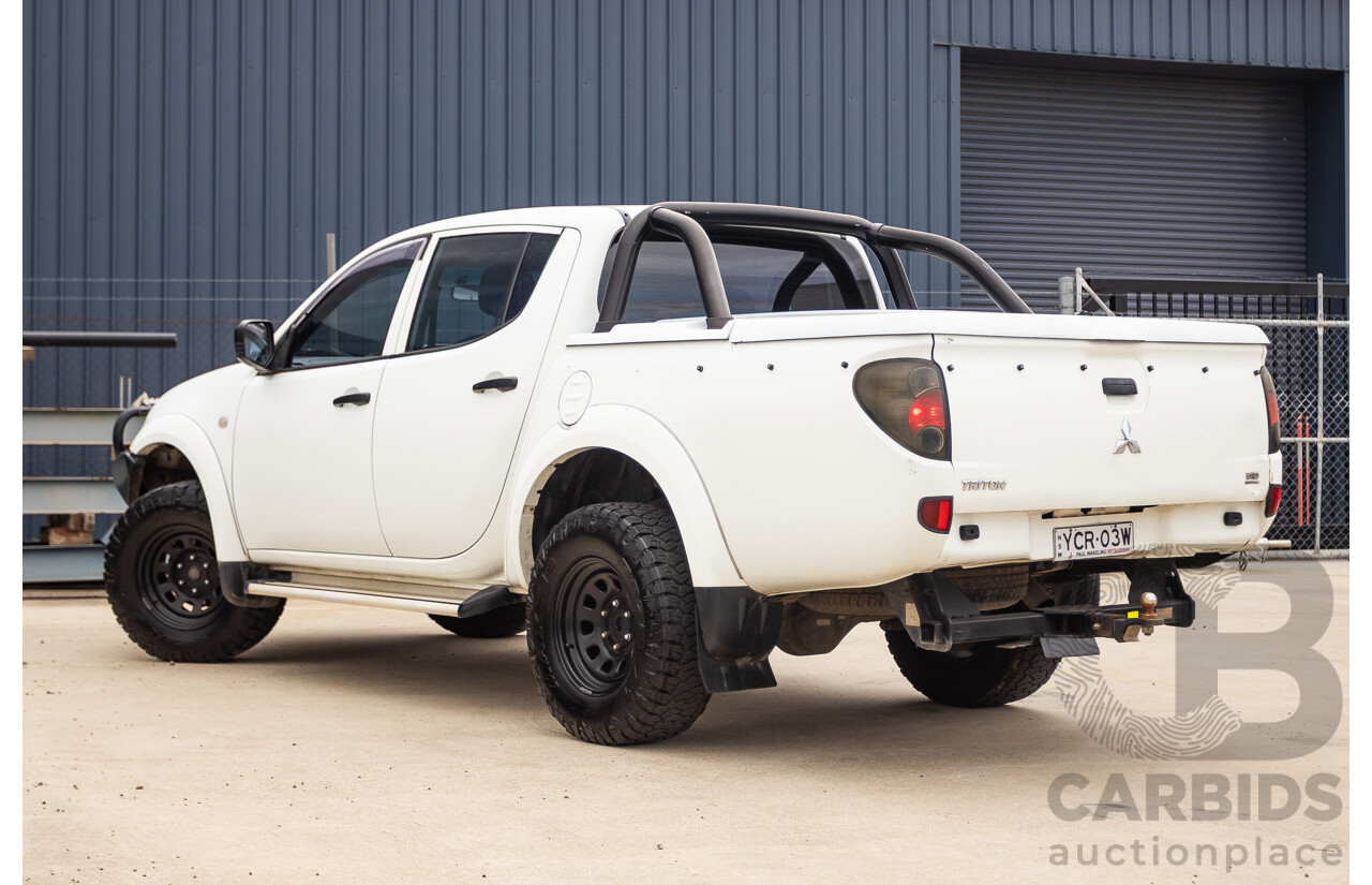9/2014 Mitsubishi Triton GLX (4x4) MN MY14 UPDATE Double Cab Utility White Turbo Diesel 2.5L