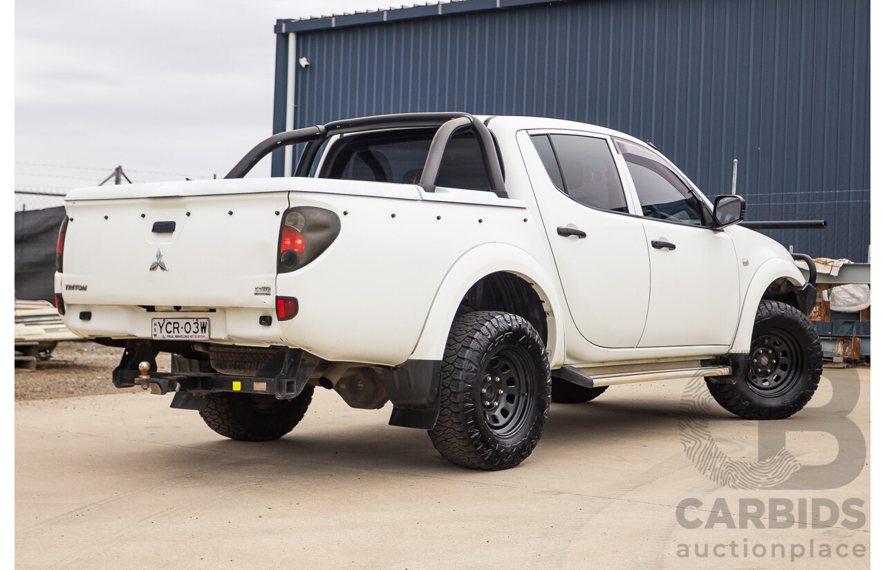 9/2014 Mitsubishi Triton GLX (4x4) MN MY14 UPDATE Double Cab Utility White Turbo Diesel 2.5L