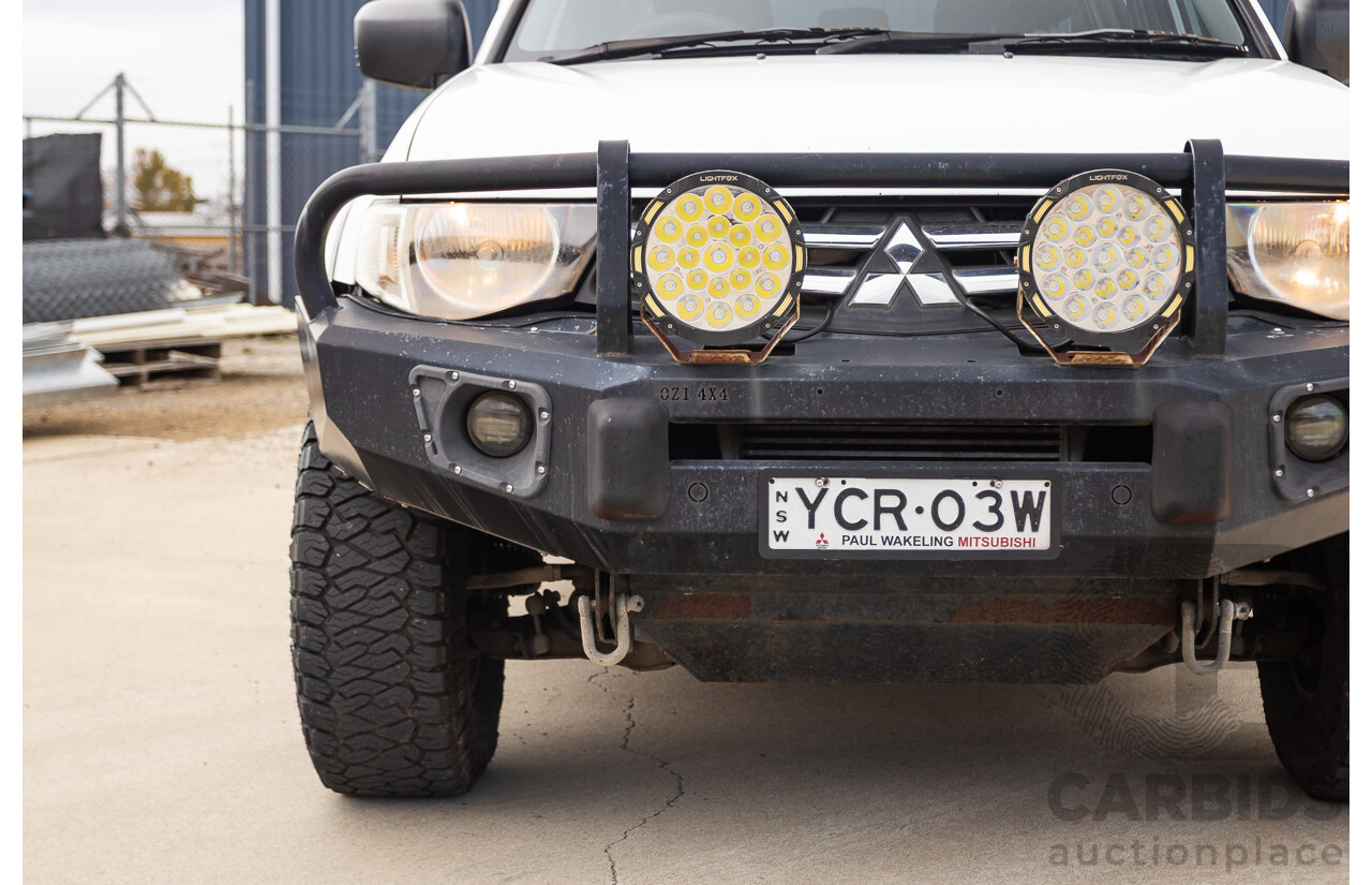 9/2014 Mitsubishi Triton GLX (4x4) MN MY14 UPDATE Double Cab Utility White Turbo Diesel 2.5L